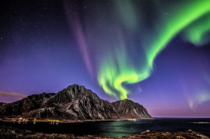 Green and purple Aurora Borealis during trip camping in Iceland in November