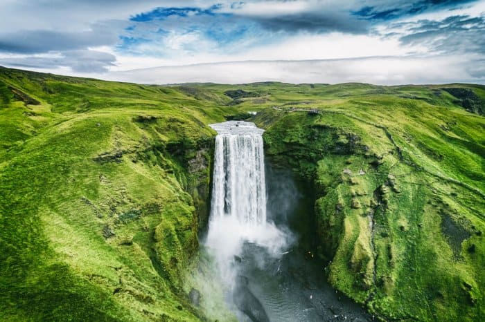 Typical Icelandic waterfall, one of the many nature wonders that suffer the tourism in Iceland pros and cons