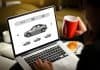 Woman searching for best Iceland car rental on laptop