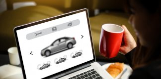 Woman searching for best Iceland car rental on laptop