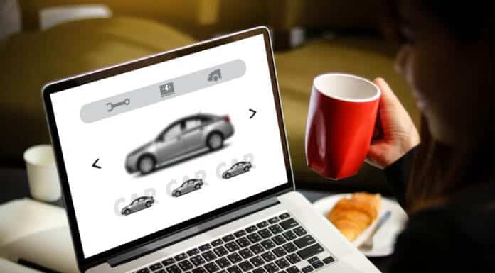 Woman searching for best Iceland car rental on laptop
