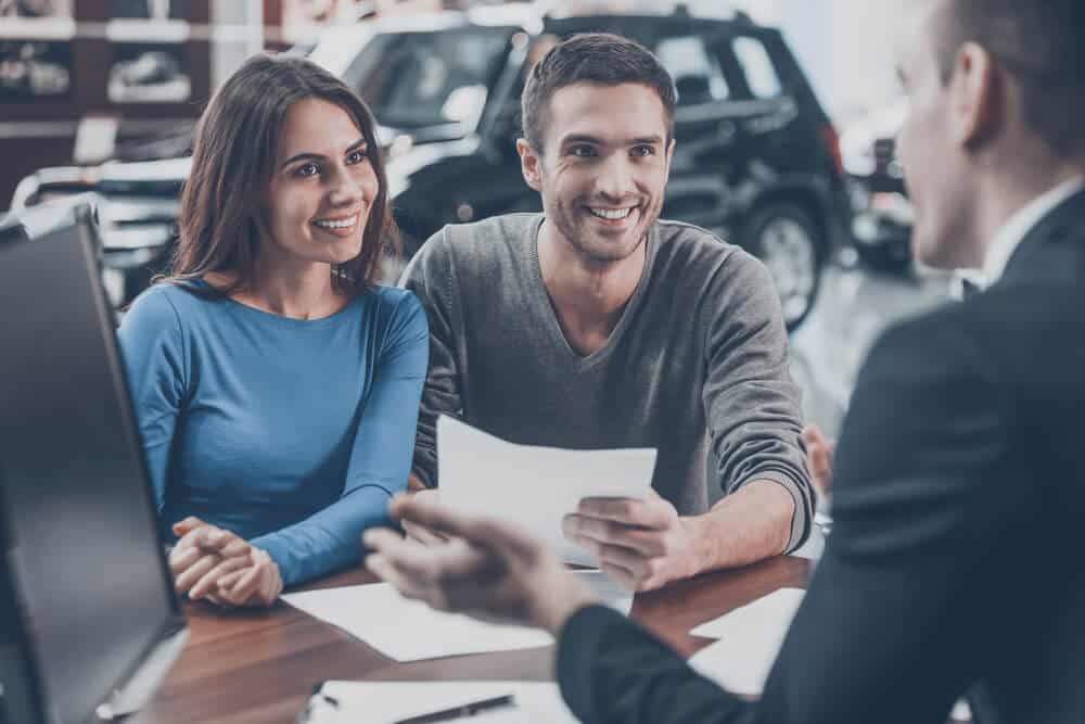 Couple at best motorhome rental company desk in Iceland