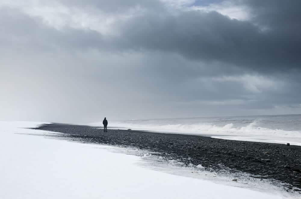 black beach and snow which usually falls in Iceland in february