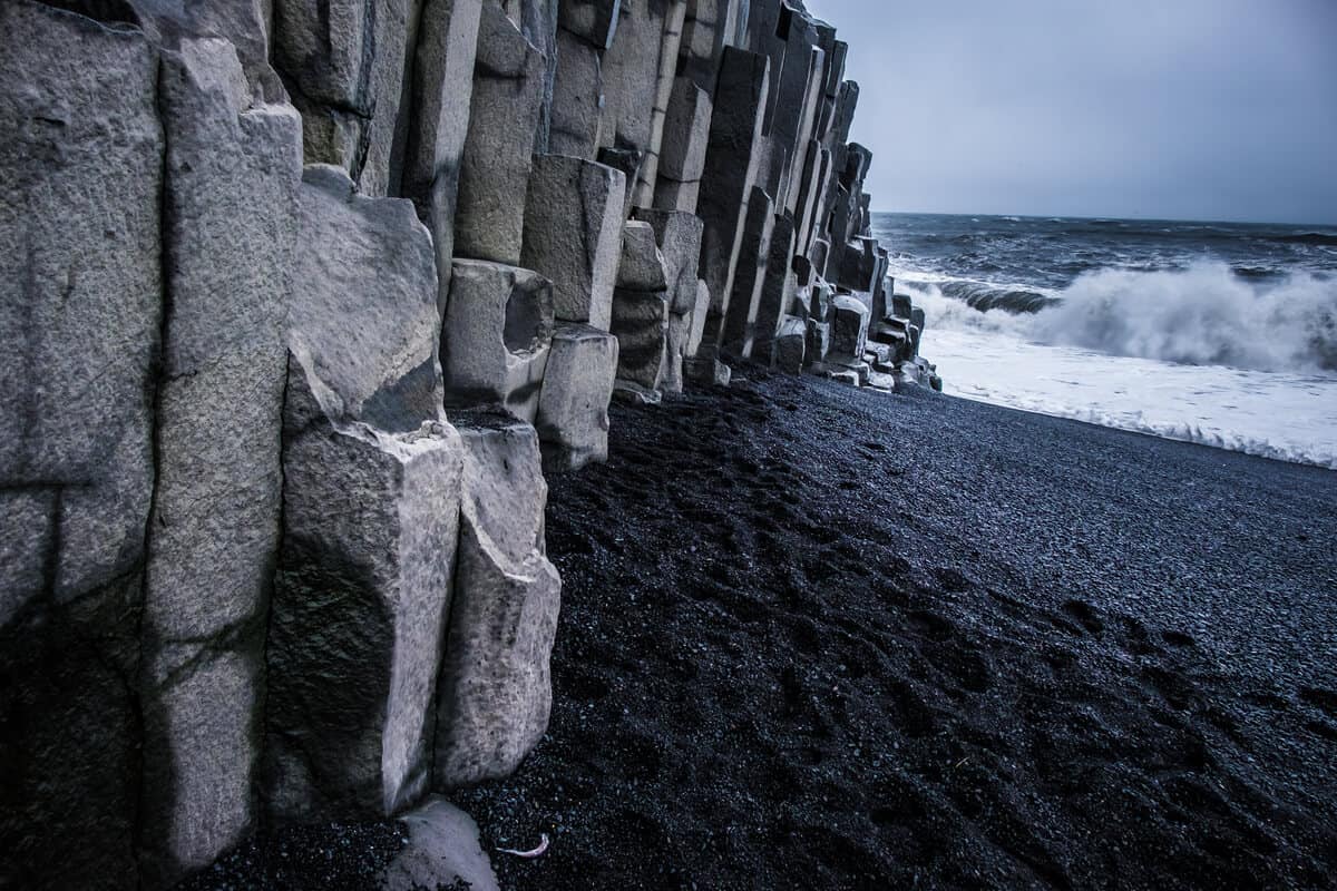 Basalt columns and jointed rock formations at Iceland's black sand beach