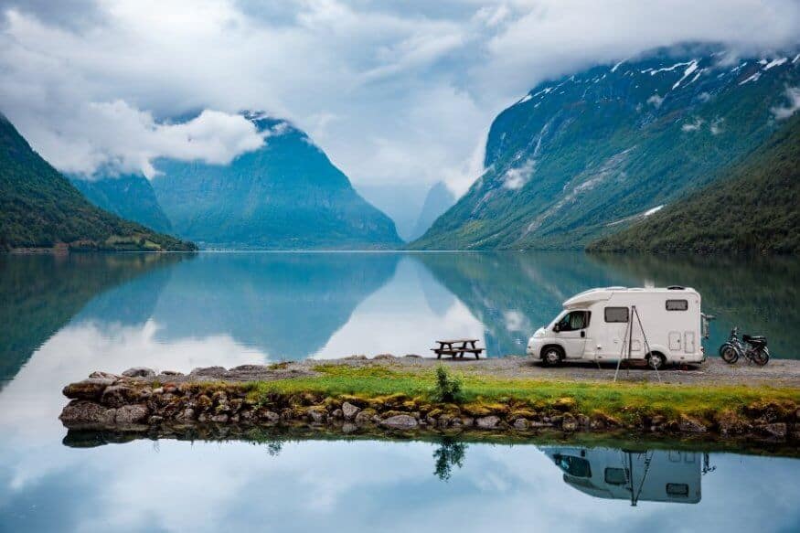 Sapphire lake with campervan during trip while camping in Iceland in November
