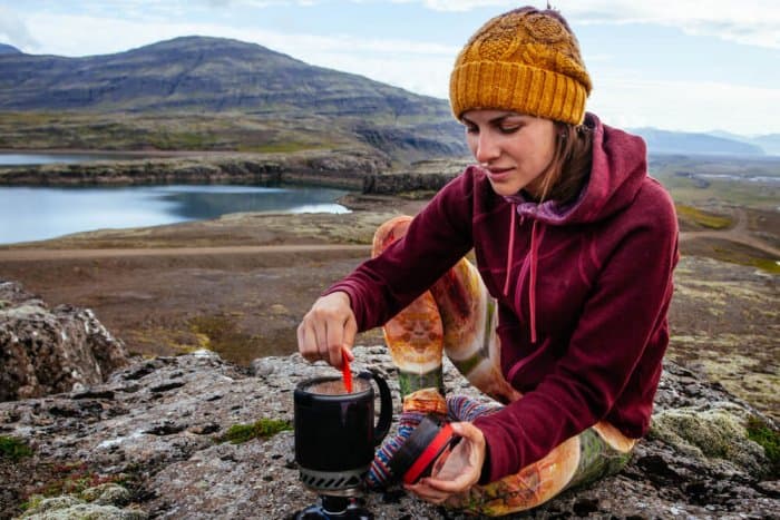 Young woman camping in Iceland