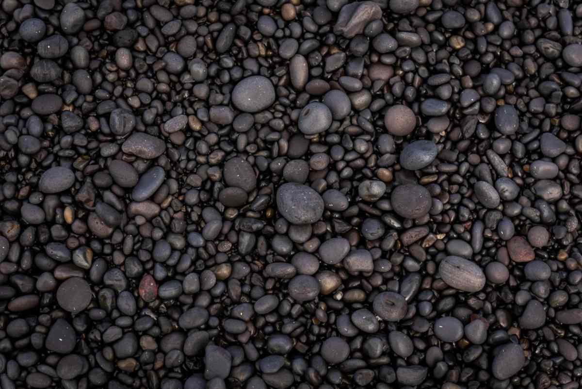 Black volcanic pebbles of djupalossandur