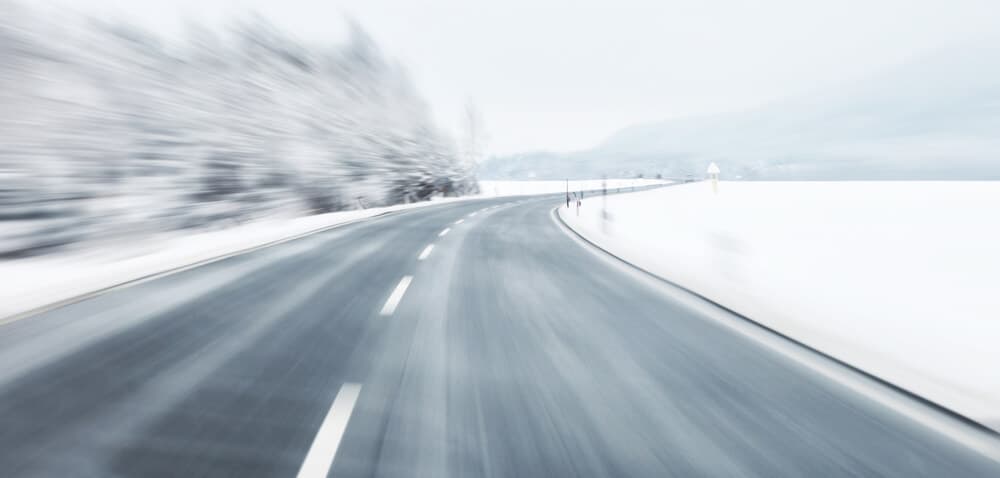 Snowy, icy road in Iceland during winter camping trip