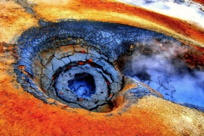 Bubbling blue mud and red earth in Hverir geothermal area is one of Iceland's major attractions
