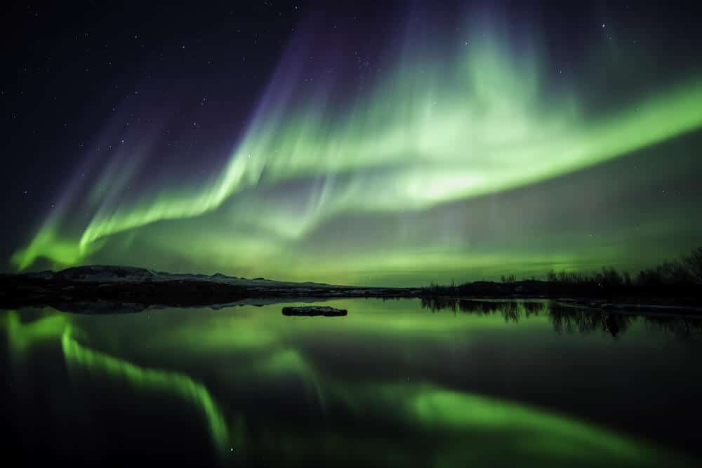 Vibrant hues of green and purple light up the fall sky in Iceland