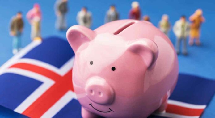 Piggy bank over a flag of Iceland