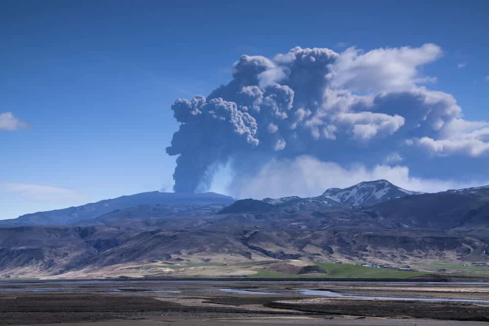 Volcanic eruption leaving a lot of ash in the air and on the ground