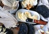Table spread with Icelandic Hardfiskur and charcoal bread with butter