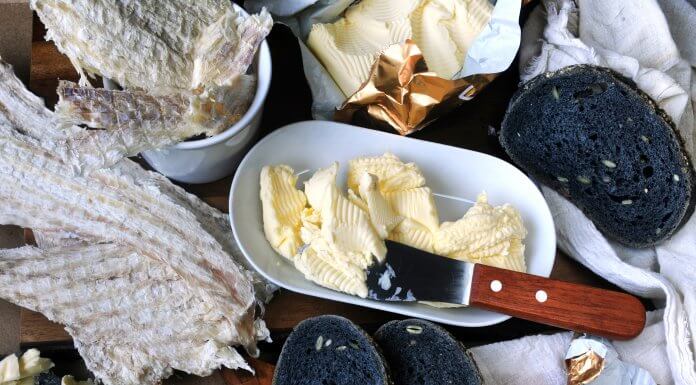 Table spread with Icelandic Hardfiskur and charcoal bread with butter