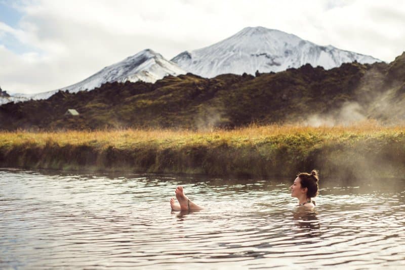 Woman soaking at an Icelandic geothermal hot pot