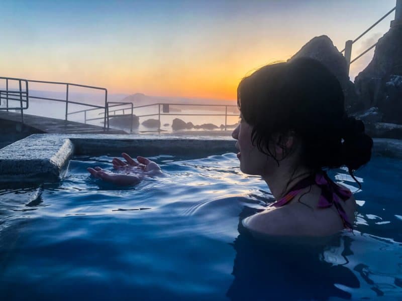 Tourist soaking at the Myvatn Nature Bath in Iceland