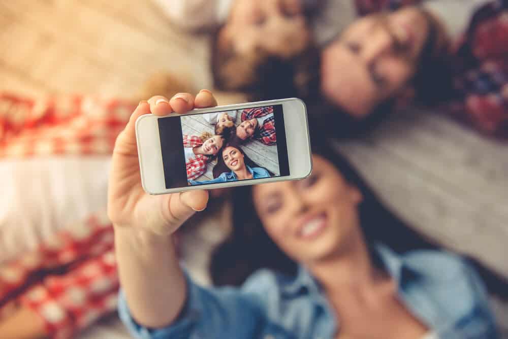 Family taking selfies in Iceland for Instagram