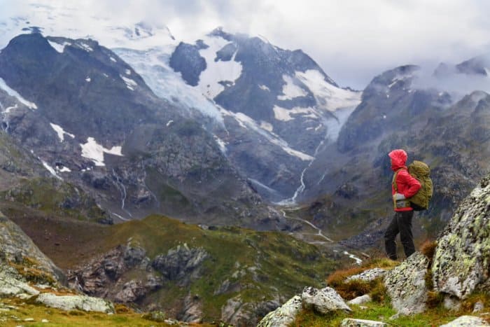 Woman in red rain jacket in Iceland
