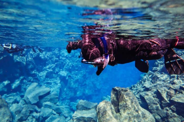 Scuba diver in the Silfra fissure in Thingvellir National Park