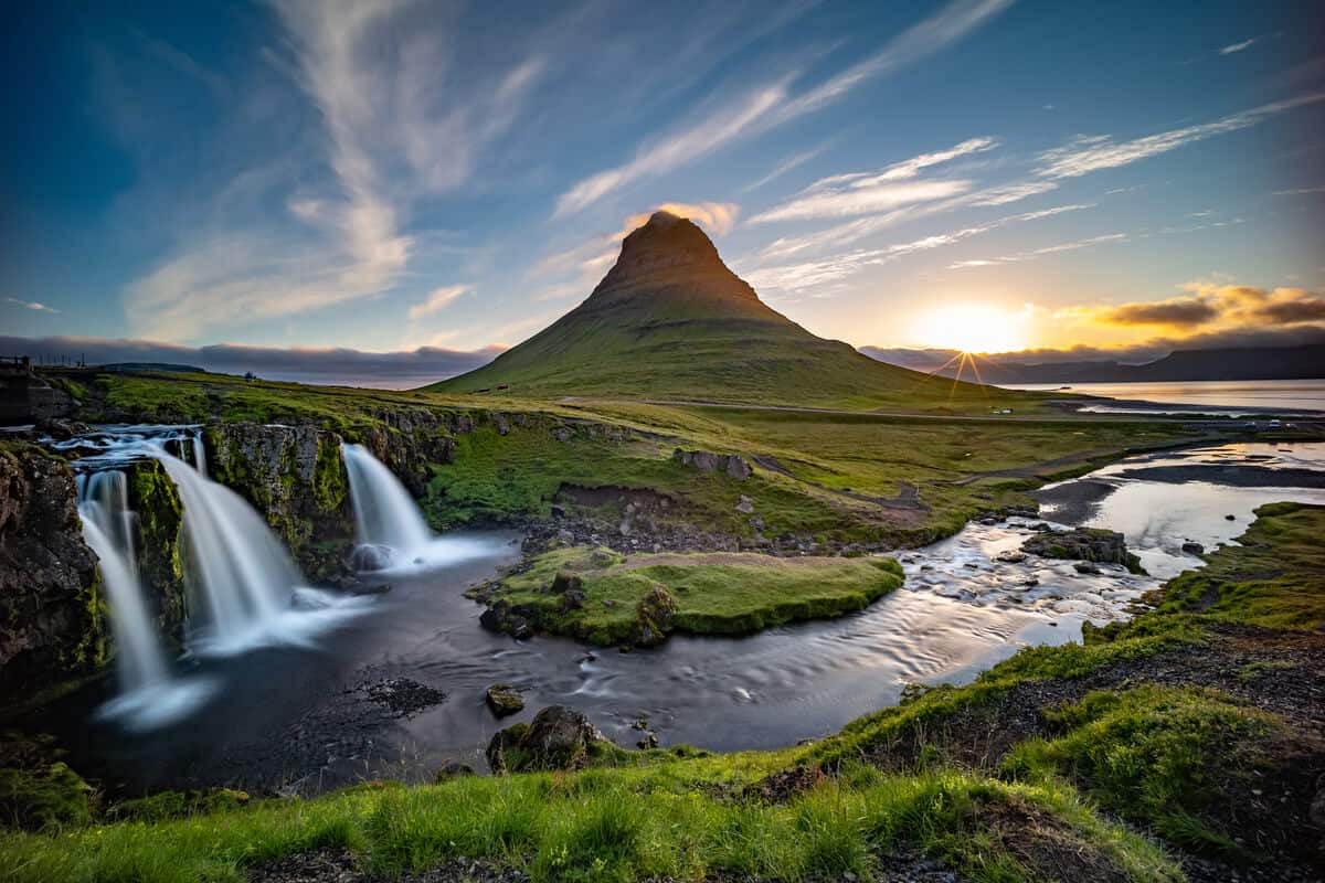 Kirkjufell mountain and Kirkjufellsfoss waterfall at sunrise
