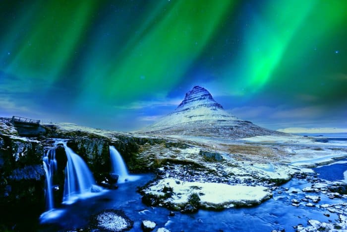 Northern Lights on Iceland's Kirkjufell mountain and Kirkjufellsfoss waterfall in Snaefellsnes peninsula