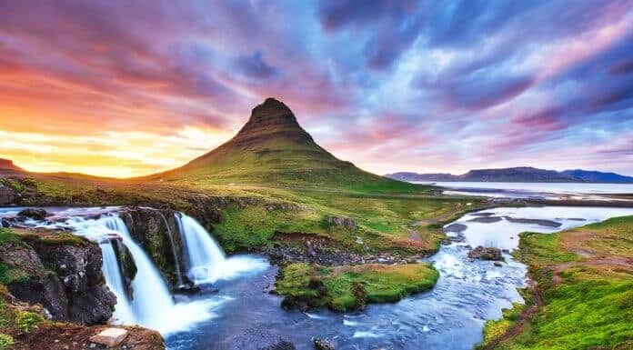 Kirkjufell mountain in Snaefellsnes peninsula with colorful sunset sky
