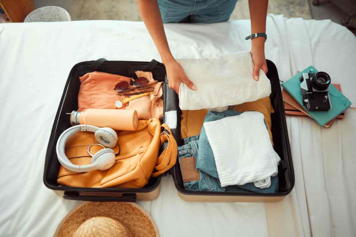 Traveler packing a suitcase for Iceland