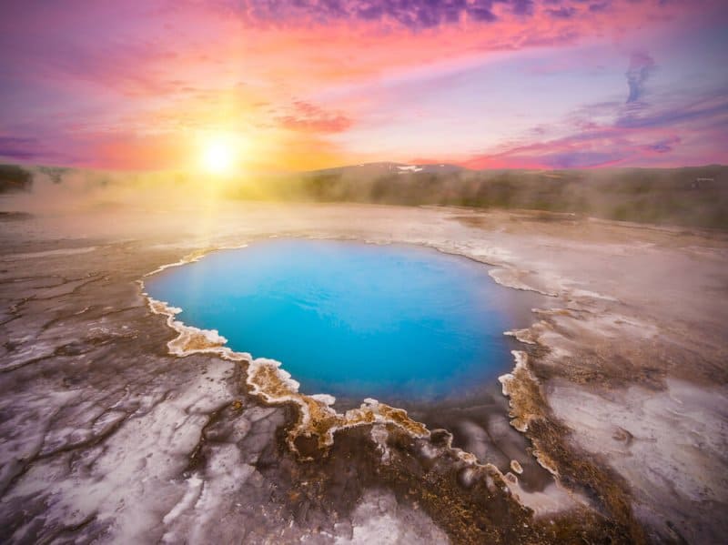 dramatic midnight sun in Iceland on a volcano crater