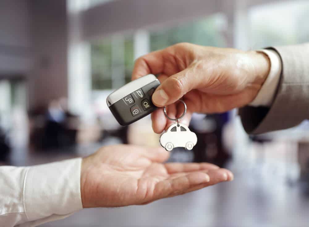 Driver receiving the keys to their Iceland car rental at Keflavik Airport