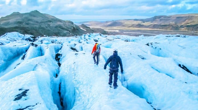 tourists hiking on a glacier in Iceland