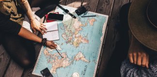 People planning their Iceland trip with a map