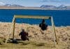 Videy island kids swinging