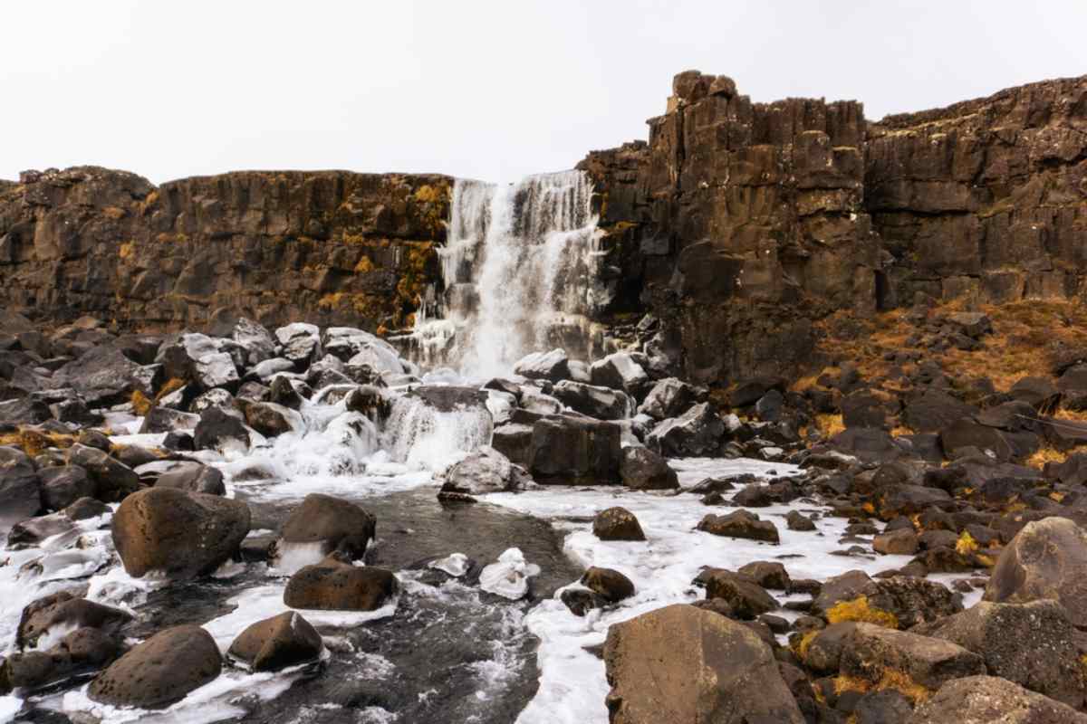 Öxarárfoss cascades gracefully over rugged rocks