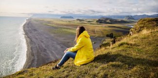 Girl checking the scenery in the mild Iceland weather in August